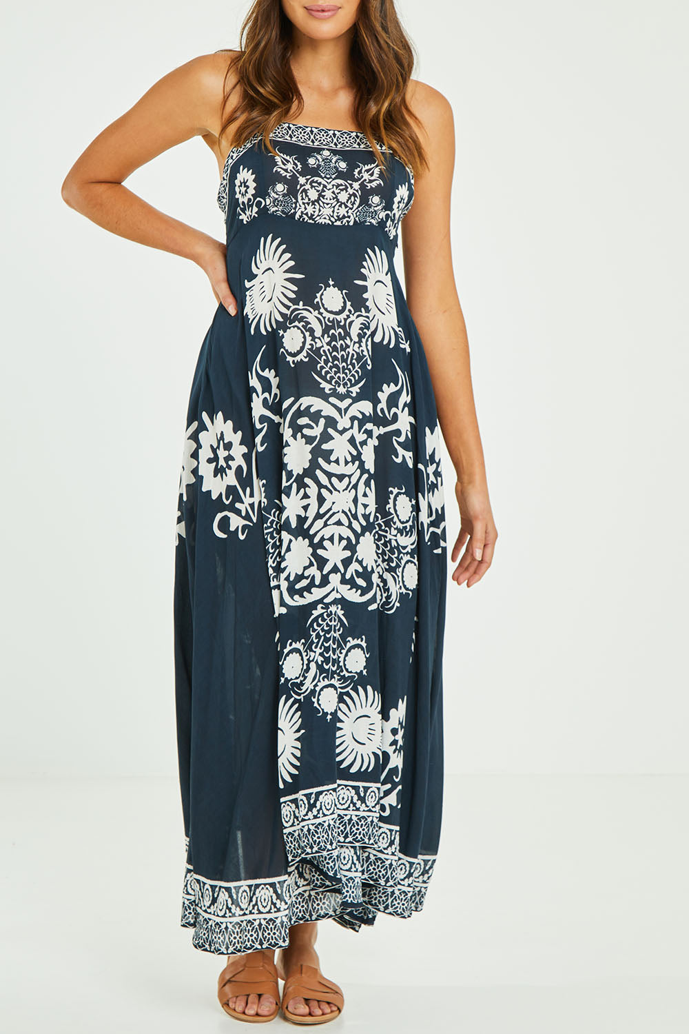 Model Madeline wearing size S of the Zari Sundress in colour Navy (Blue), from the front, cropped image