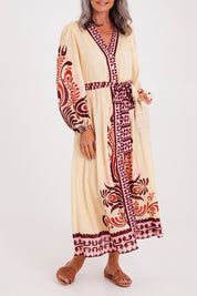 Model Luisa wearing size S of the Zeezee Dress in colour Cream, from the front, cropped image