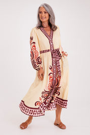 Model Luisa wearing size S of the Zeezee Dress in colour Cream, from the front, showing the whole outfit