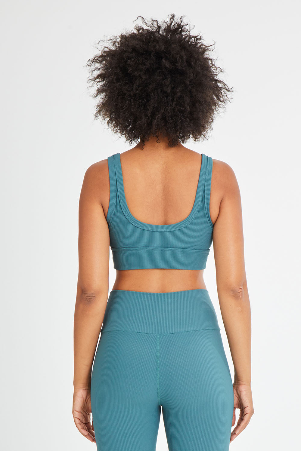 Model Olivia wearing size 10 of the Scoop It Up Sports Bra in colour Sage (Green), from the back