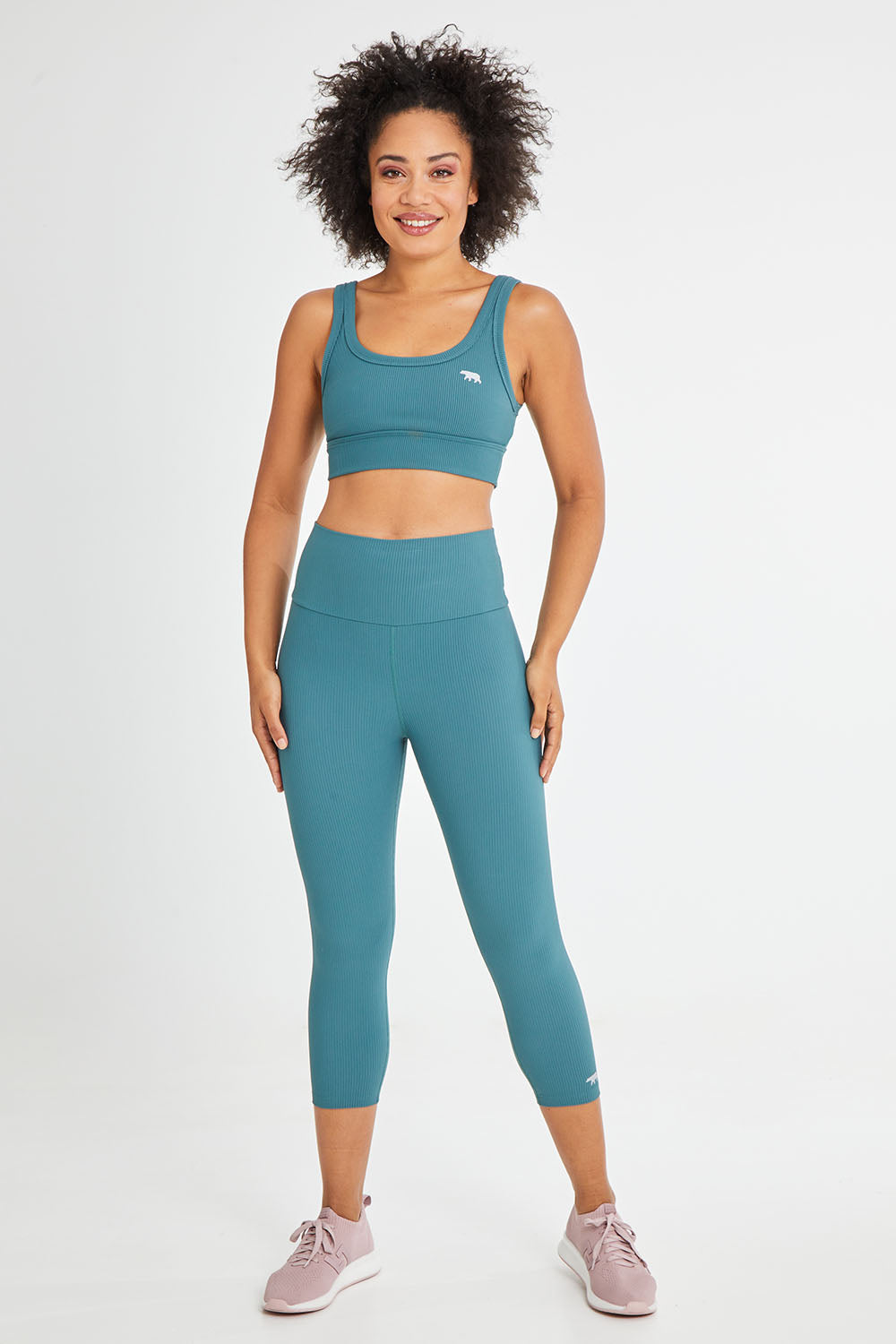 Model Olivia wearing size 10 of the Scoop It Up Sports Bra in colour Sage (Green), from the front, showing the whole outfit