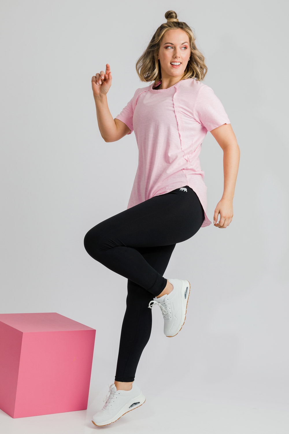 Model Jess wearing size 14 of the High Rise Full Length Tight in colour Black (Black), from the front, showing the whole outfit