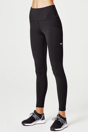 A model wearing the Ab Waisted Power Moves Pockets Full Length Tight in colour Black (Black), from the front, cropped image