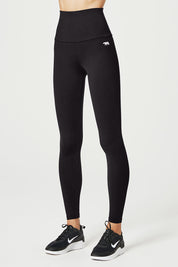 A model wearing the Abtastic Studio Full Length Tight in colour Black (Black), from the front, cropped image