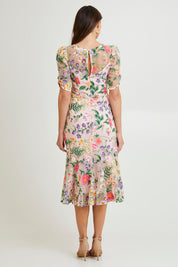 Model Madeline wearing size 10 of the Cardelina Embroidered Mesh Dress in colour Lavender (Pink), from the back