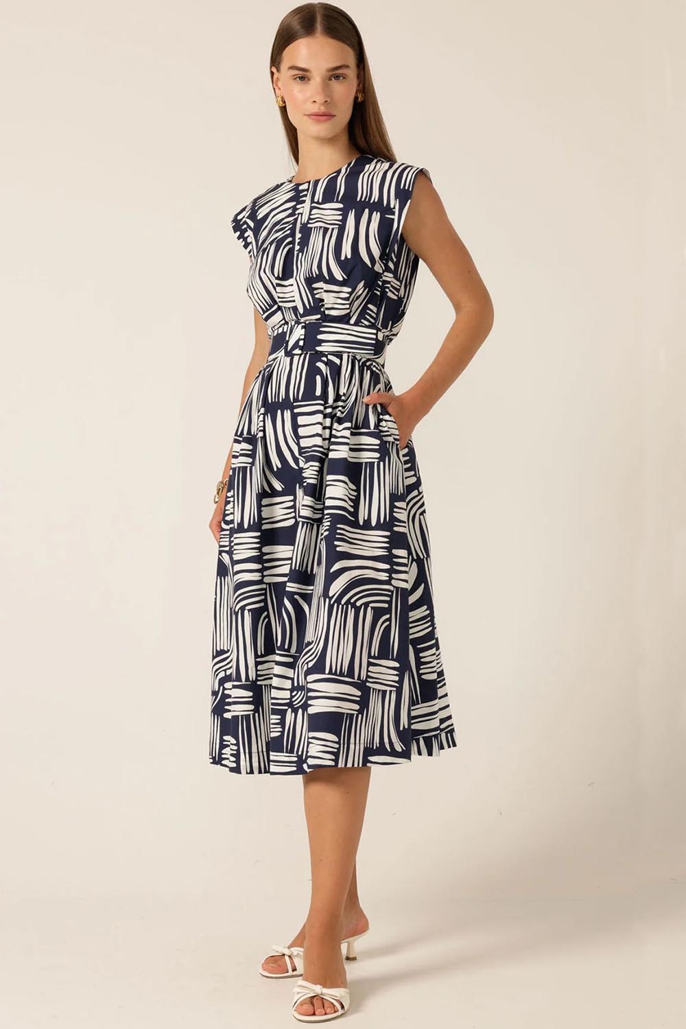 A model wearing the Clermont Cotton Fit And Flare Dress in colour Navy (Blue), from the front, showing the whole outfit