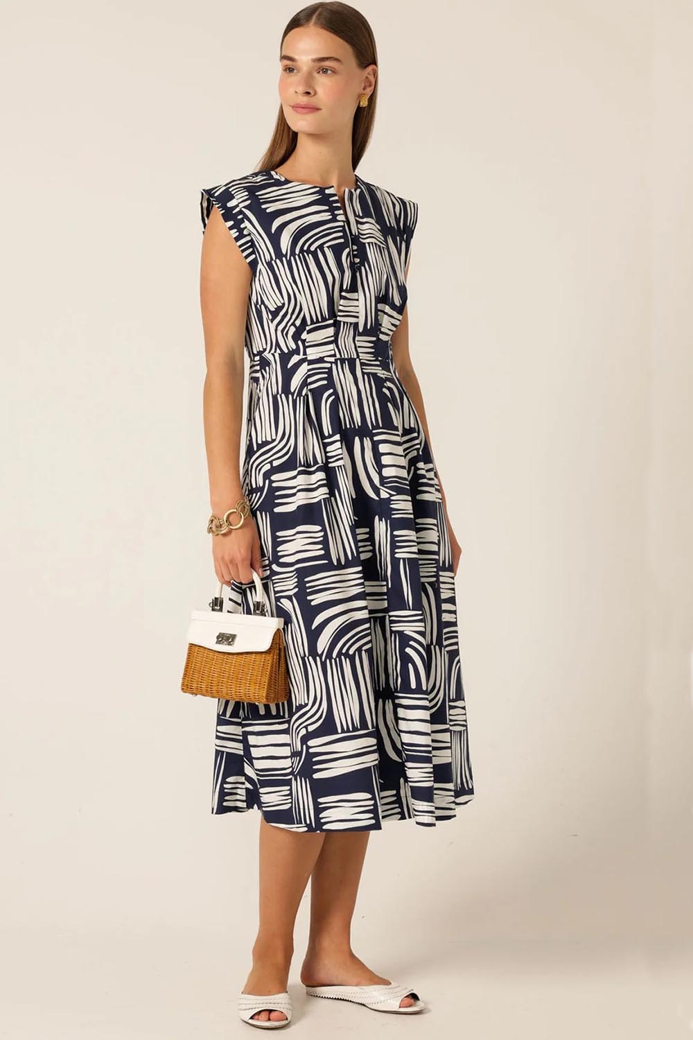 A model wearing the Clermont Cotton Fit And Flare Dress in colour Navy (Blue), from the front, showing the whole outfit