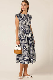 A model wearing the Clermont Cotton Fit And Flare Dress in colour Navy (Blue), from the front, showing the whole outfit