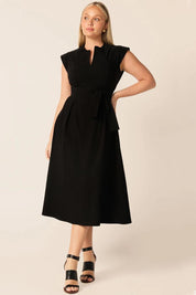 A model wearing the Zip Front Fit & Flare Dress in colour Black (Black), from the front, showing the whole outfit
