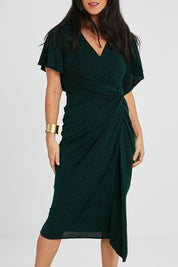 Model Katie wearing size 10 of the Emporium Dress in colour Emerald (Green), from the front, cropped image
