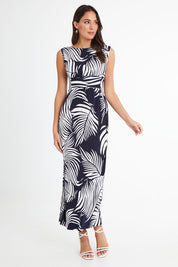 Model Madeline wearing size 10 of the Moonshadow Palm Maxi Dress in colour Navy (Blue), from the front, showing the whole outfit