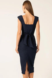 A model wearing the Celestial Dress in colour Navy (Blue), from the back