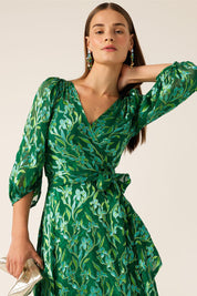 A model wearing the Orchid Wrap Dress in colour Green (Green), from the front, cropped image
