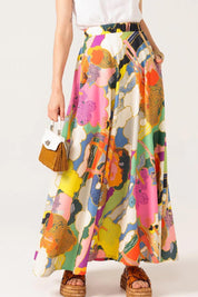 A model wearing the Florida Cotton Maxi Skirt in colour Cloud, from the front, cropped image
