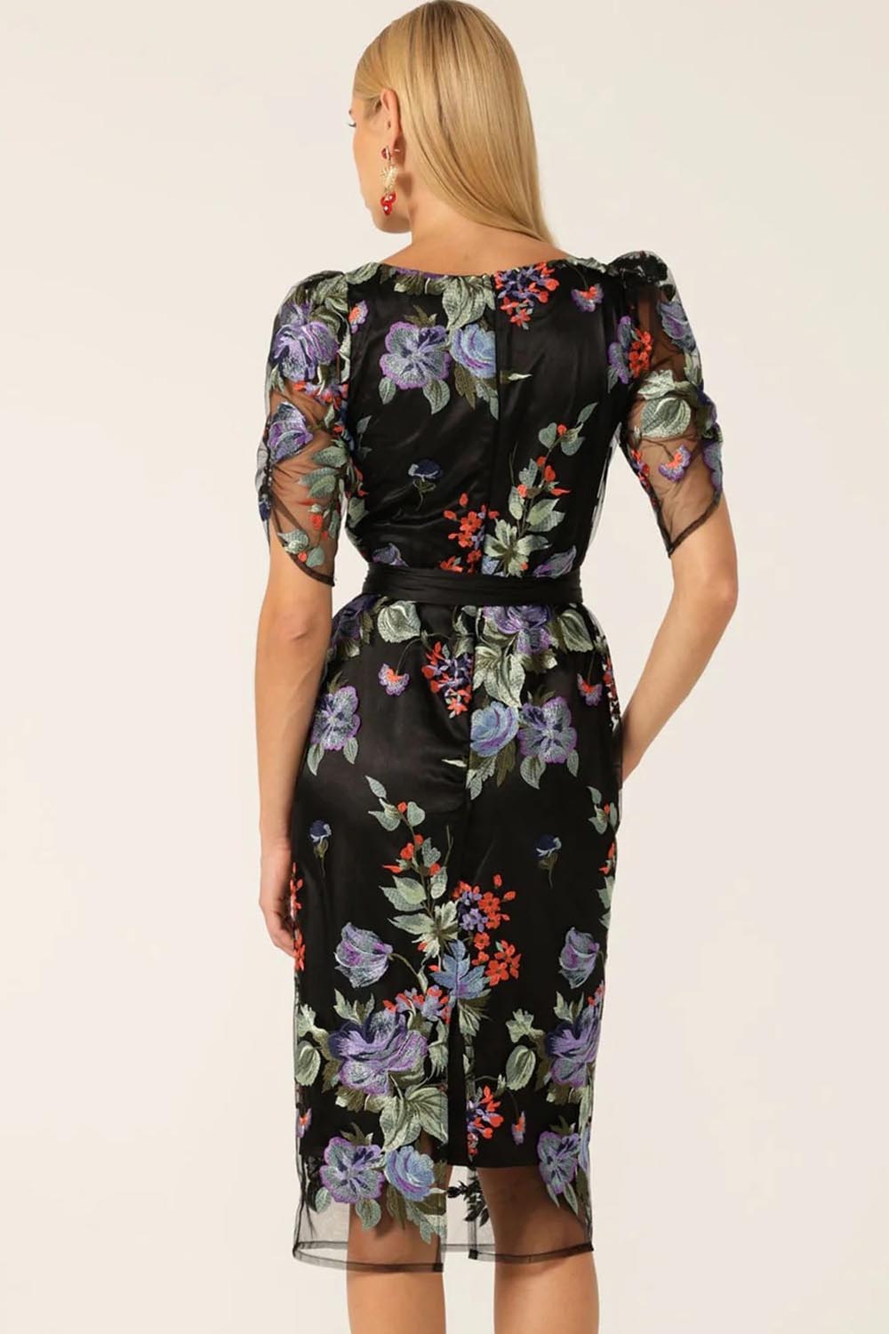 A model wearing the Mont Tombe Dress in colour Floral (Black), from the back