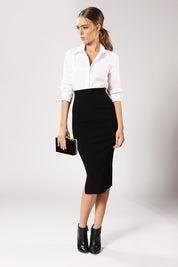 A model wearing the Pencil Skirt in colour Black (Black), from the front, showing the whole outfit
