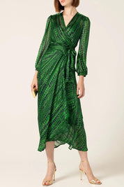 A model wearing the Savoir Midi Wrap Dress in colour Green (Green), from the front, cropped image