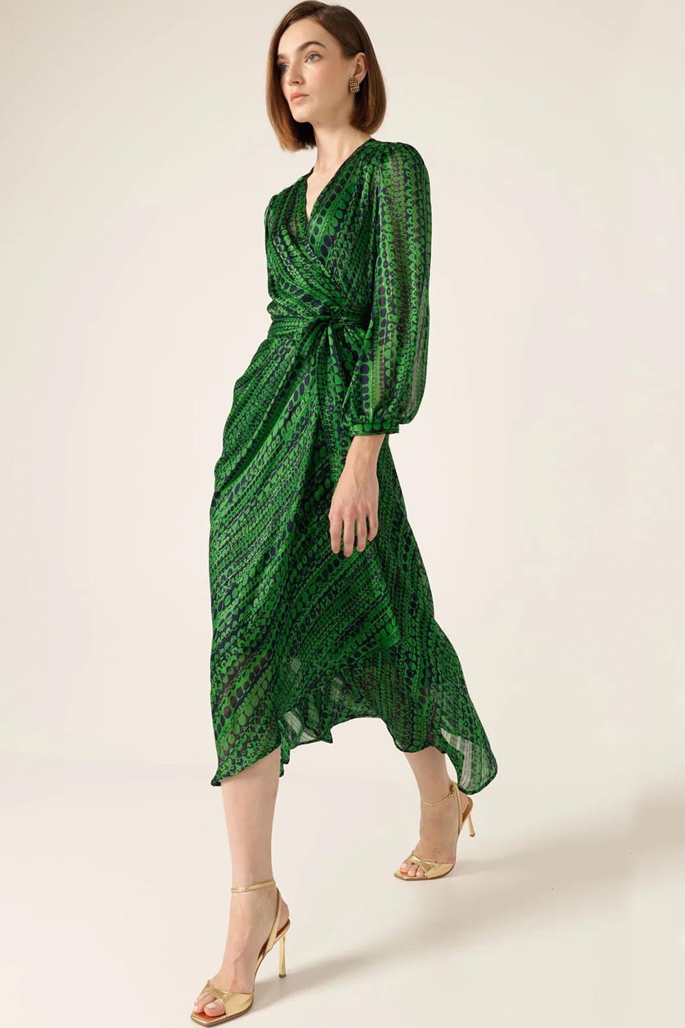 A model wearing the Savoir Midi Wrap Dress in colour Green (Green), from the front, showing the whole outfit