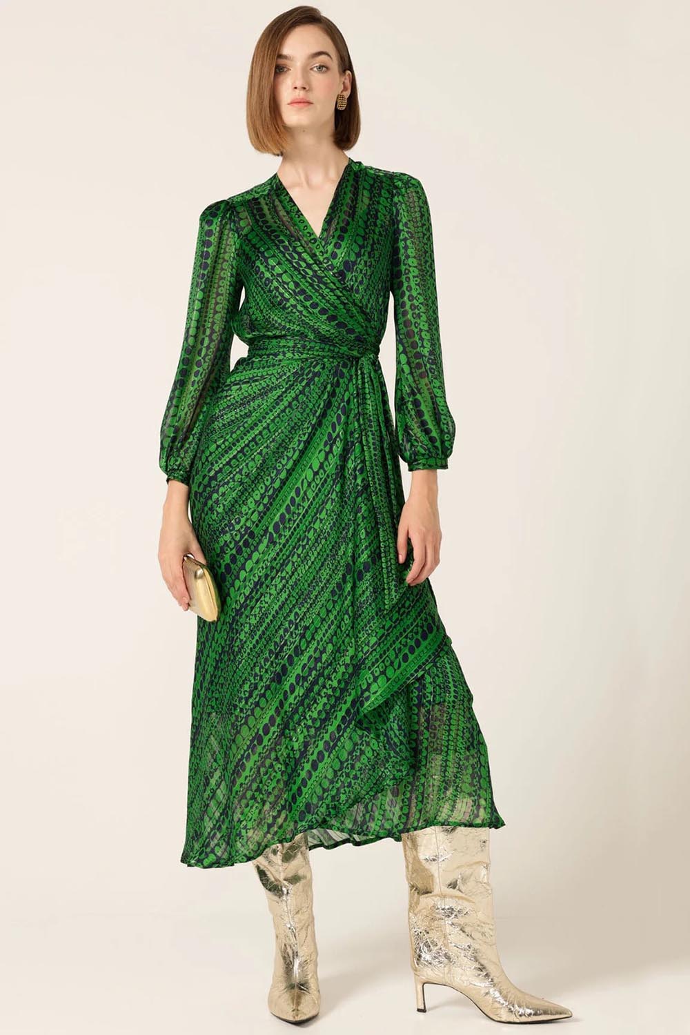 A model wearing the Savoir Midi Wrap Dress in colour Green (Green), from the front, showing the whole outfit