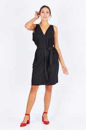 Model Madeline wearing size 10 of the Column Drape Dress in colour Black (Black), from the front, showing the whole outfit