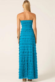 A model wearing the Maddison Maxi Ruffle Dress in colour Aqua (Blue), from the back