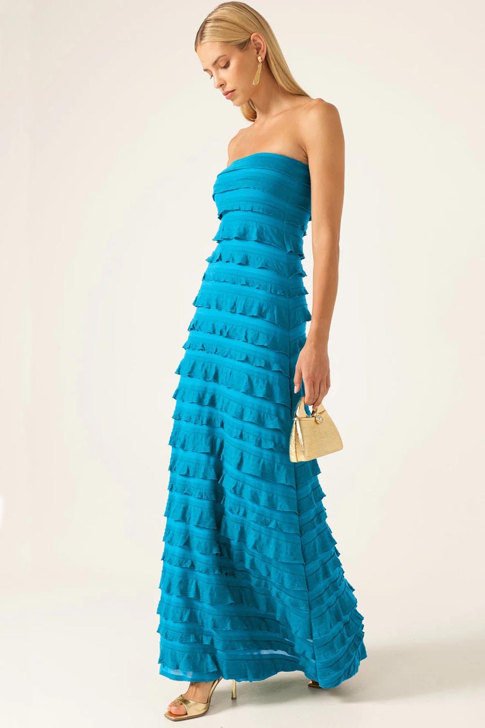 A model wearing the Maddison Maxi Ruffle Dress in colour Aqua (Blue), from the front, showing the whole outfit