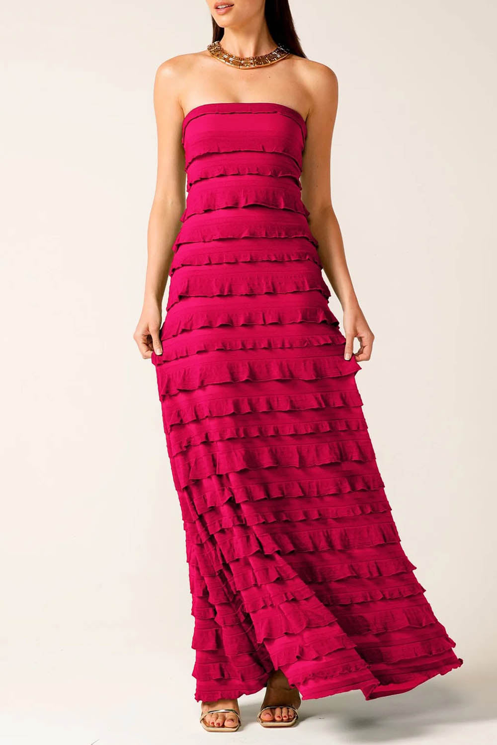 A model wearing the Maddison Maxi Ruffle Dress in colour Raspberry (Pink), from the front, cropped image