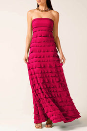 A model wearing the Maddison Maxi Ruffle Dress in colour Raspberry (Pink), from the front, cropped image
