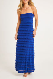 Model Alice wearing size 10 of the Maddison Maxi Ruffle Dress in colour Sapphire (Blue), from the front, cropped image
