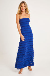 Model Alice wearing size 10 of the Maddison Maxi Ruffle Dress in colour Sapphire (Blue), from the front, showing the whole outfit