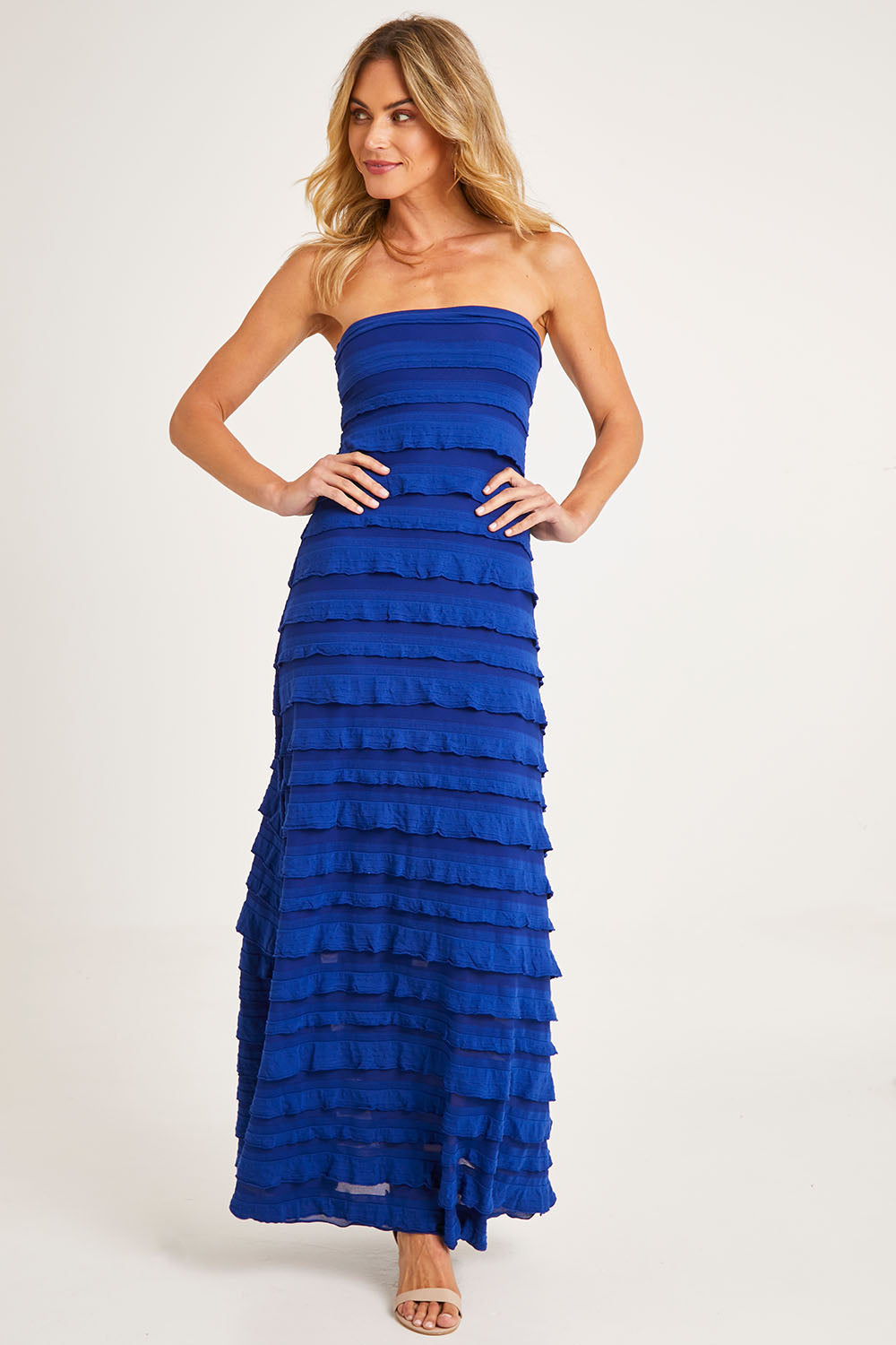 Model Alice wearing size 10 of the Maddison Maxi Ruffle Dress in colour Sapphire (Blue), from the front, showing the whole outfit