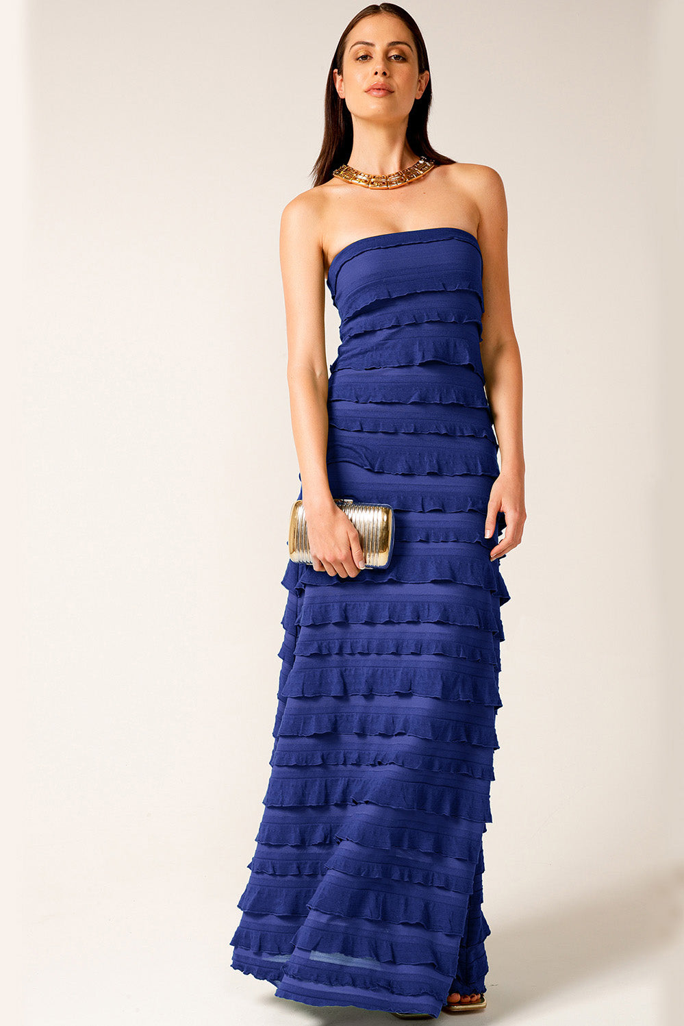 A model wearing the Maddison Maxi Ruffle Dress in colour Sapphire (Blue), from the front, showing the whole outfit