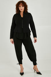 Model Maddy wearing size 16 of the Front Zip Peplum Jacket in colour Black (Black), from the front, showing the whole outfit