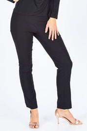 Model Gemma wearing size 10 of the Skinny Pant in colour Black (Black), from the front, cropped image