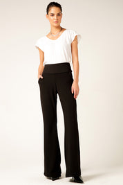 A model wearing the Classic Trouser in colour Black (Black), from the front, showing the whole outfit