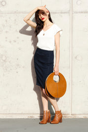 A model wearing the Denim Skirt in colour IndigoDen (Blue), from the front, showing the whole outfit