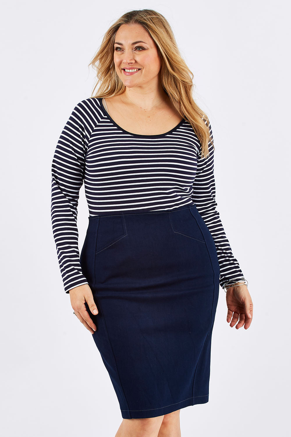 Model Ljubenka wearing size 16 of the Denim Skirt in colour IndigoDen (Blue), from the front, cropped image