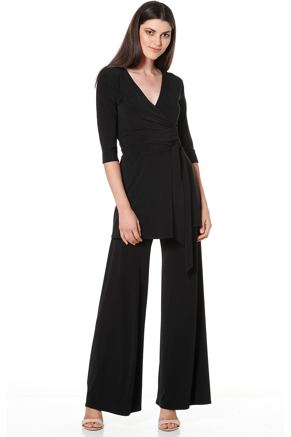 A model wearing the Turn around Tunic in colour Black (Black), from the front, showing the whole outfit
