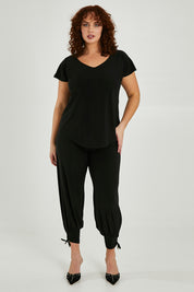 Model Maddy wearing size 16 of the Analia Reversible Top in colour Black (Black), from the front, showing the whole outfit