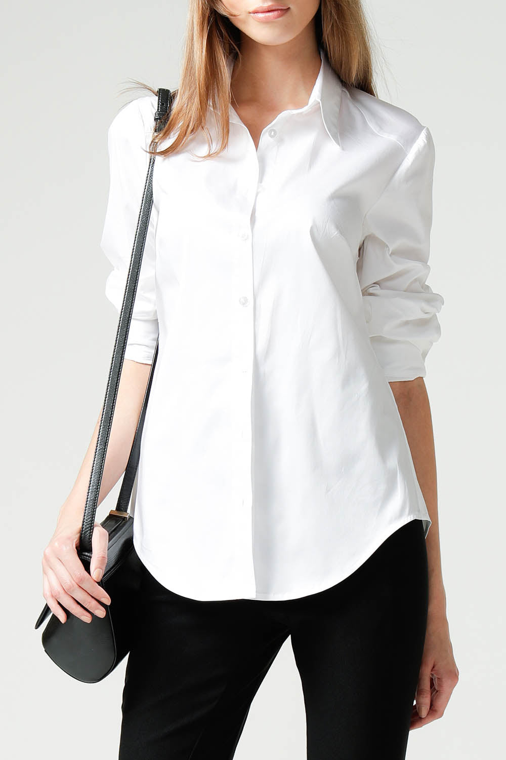 A model wearing the Classic Shirt in colour White (White), from the front, cropped image