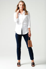 A model wearing the Classic Shirt in colour White (White), from the front, showing the whole outfit