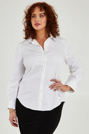 Model Maddy wearing size 16 of the Classic Shirt in colour White (White), from the front, cropped image