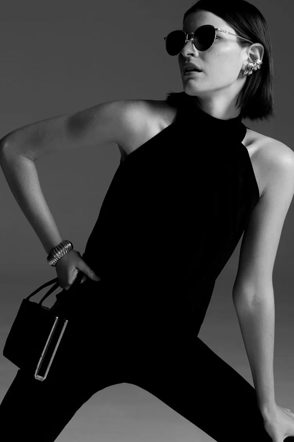 A model wearing the High Neck Tie Top in colour Black (Black), from the front, showing the whole outfit