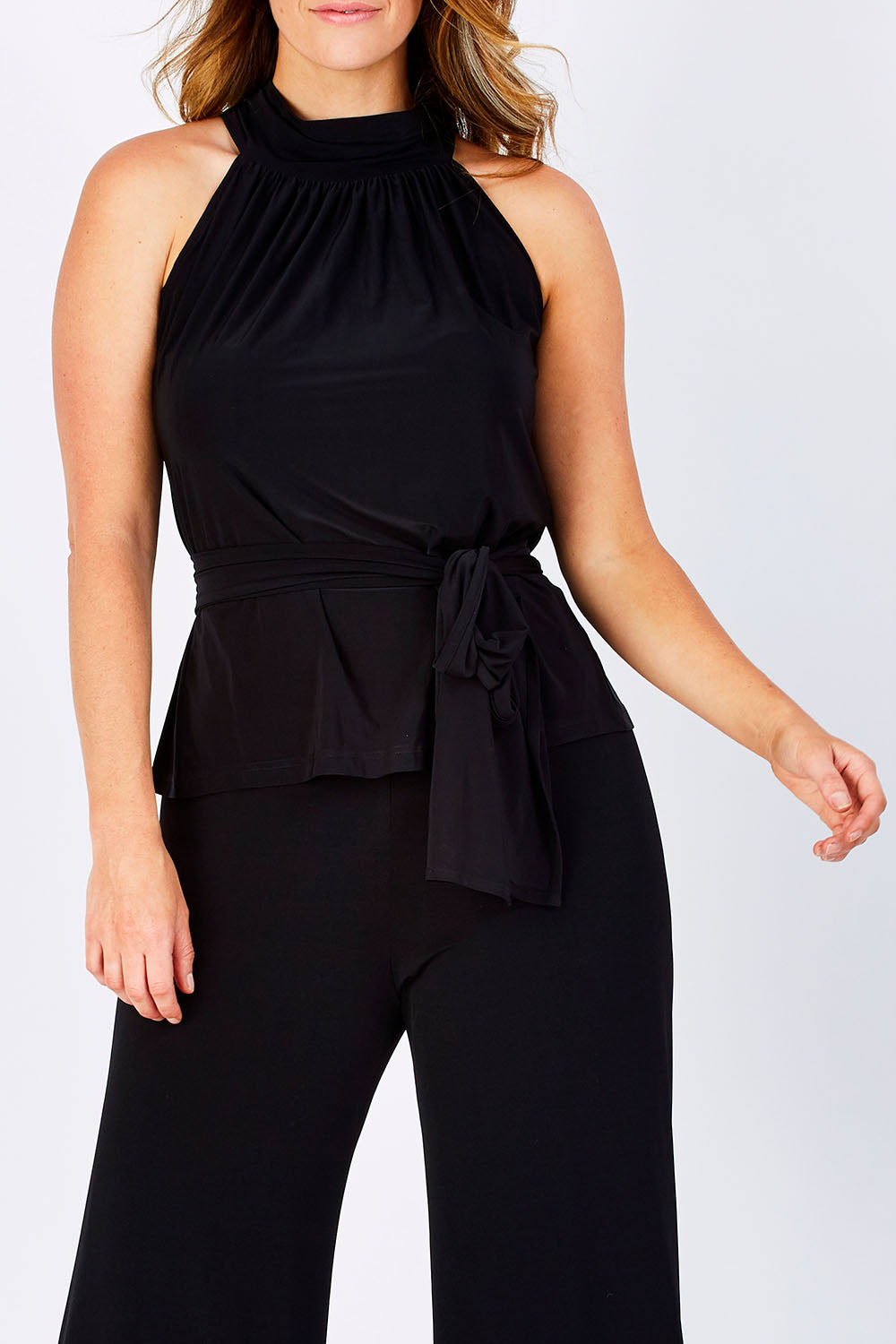 Model Laura wearing size 12 of the High Neck Tie Top in colour Black (Black), from the front, cropped image