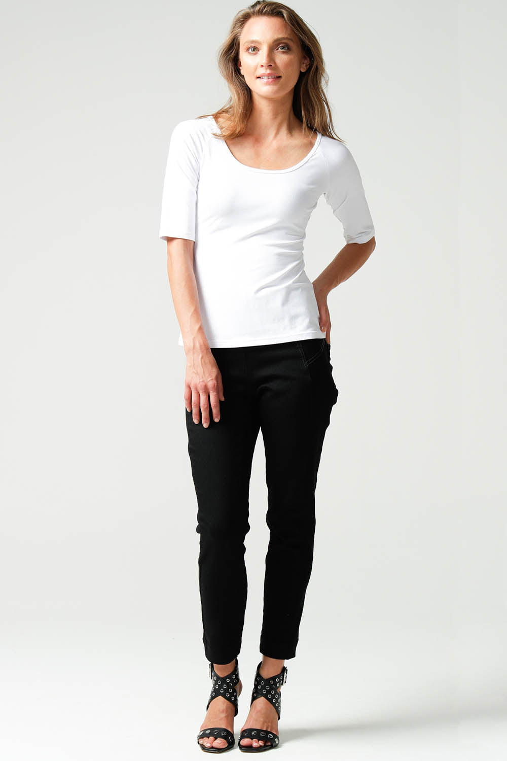A model wearing the 3/4 Sleeve Top in colour White (White), from the front, showing the whole outfit