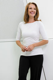 Model Katie wearing size 10 of the 3/4 Sleeve Top in colour White (White), from the front, showing the whole outfit