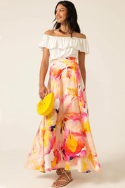 A model wearing the Sunspritz Linen Wrap Skirt in colour Hibiscus (Pink), from the front, showing the whole outfit