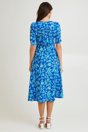 Model Madeline wearing size 10 of the Sweet Pea Midi Dress in colour Blue (Blue), from the back