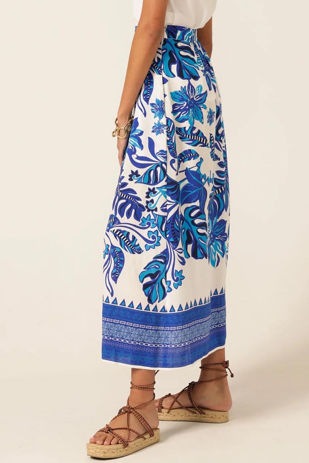 A model wearing the Yacht Party Skirt in colour Messina (Blue), from the back