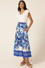 A model wearing the Yacht Party Skirt in colour Messina (Blue), from the front, showing the whole outfit